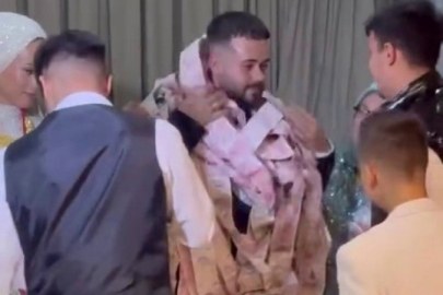 Bursa'da damadı paraya boğdular