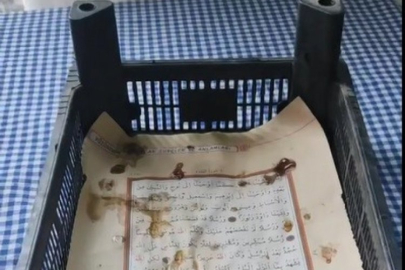 Kuran-ı Kerim'i kasanın altına serdi!