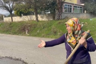 Bozuk yolu kendi imkanlarıyla onardı