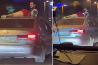 Seyir halindeki otomobilin tavanında twerk yapmaya çalıştı