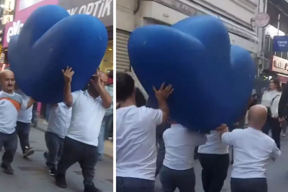 Vatandaşlar şaşkınlıkla izledi! Bir grup cüce cadde boyunca "F" harfi taşıdı