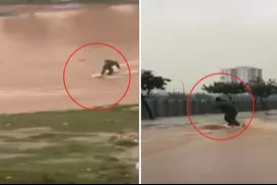 Suyla dolan caddede sörf yaptı