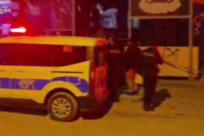 Alkol alırken tartıştıkları adamı arkadaşıyla birlikte başına taşla vurarak öldürmüş