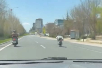 Canını hiçe sayıp motosikleti üzerine uzanarak sürdü